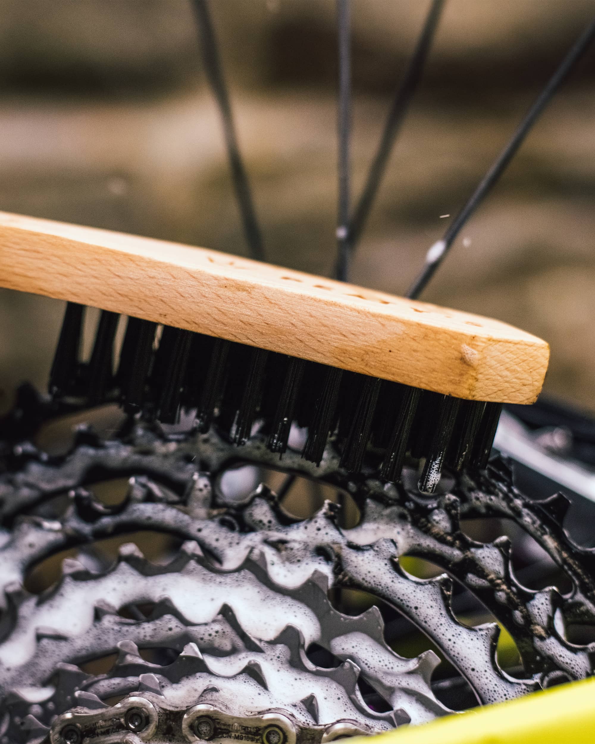 Peaty's Drivetrain Brush in use on a cassette